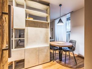 a small dining room with a table and chairs at Apartment La Spada by Interhome in Ossana