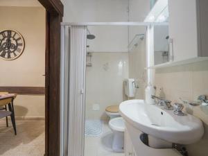 a bathroom with a sink and a toilet at Apartment Nido nel centro by Interhome in Camaiore