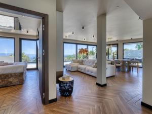 a living room with a couch and a table at Villa Black Imperium by Interhome in Mošćenička Draga