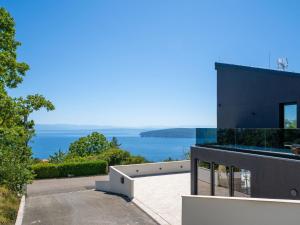 a house with a view of the ocean at Villa Black Imperium by Interhome in Mošćenička Draga