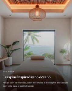 a bedroom with a bed with a view of the ocean at Hotel Sedrim in Imperatriz