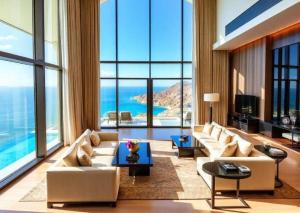 a living room with white furniture and large windows at Hotel Sedrim in Imperatriz