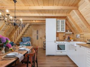 a kitchen and dining room with a wooden ceiling at Chalet Ivica by Interhome in Sveti Rok