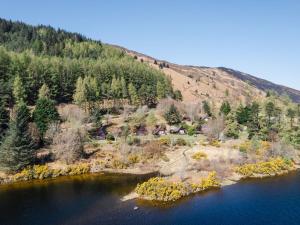 an island in the middle of a body of water at Chalet Glengarry Combi by Interhome in Spean Bridge