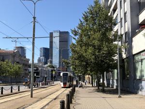 a city street with a bus on a street at Nomad Boutique Hostel - Women Only, Self Check-In, City Centre in Tallinn