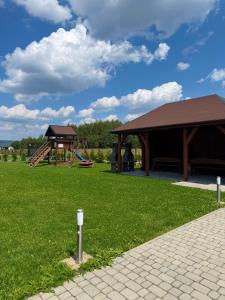 a park with a pavilion and a playground at Agroturystyka Ostoja Wilków II in Wilków +12 photos