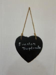 a black heart hanging on a wall with the words revision unpredictable at Les Prunus Clermont -Créans 2 personnes in Clermont-Créans +3 photos