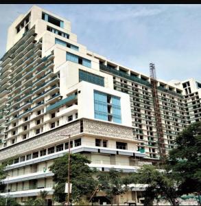 a large white building with a lot of windows at Royal Stays in Greater Noida