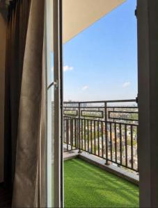 a balcony with a view of the ocean at Royal Stays in Greater Noida