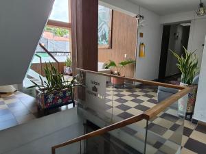 a room with a staircase with potted plants at Hotel La Mansión in La Pintada +12 photos