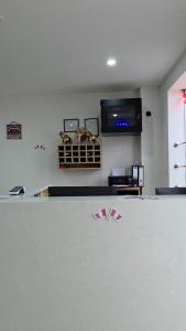 a room with a table with two red shoes on it at Hotel San Cosme in Camaná +11 photos