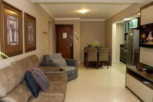a living room with a couch and a table at Canela Dreams - Stay House Temporada in Canela