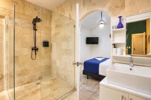 a bathroom with a shower and a sink at Casa roof in Las Terrenas +22 photos
