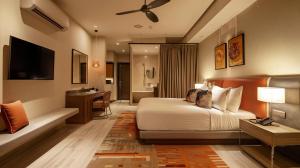 a hotel room with a bed and a desk at Hotel Luxury Villa - Near IGI Airport Mahipalpur New Delhi in New Delhi