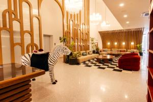 a zebra statue in the middle of a lobby at Hotel Indigo Tijuana Downtown by IHG in Tijuana