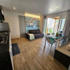 a living room with a couch and a table at Mobile House 4 you, Murter - Slanica in Murter +44 photos
