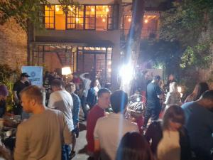 a crowd of people standing outside of a building at LA CASITA in Buenos Aires +165 photos