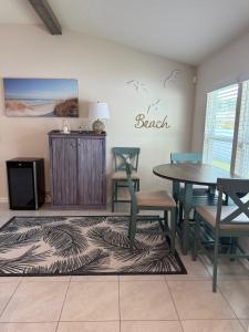 a dining room with a table and chairs at Rybark Manor in Palm Coast