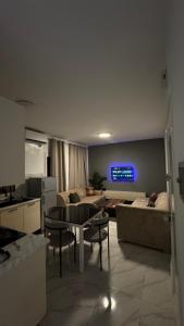 a living room with a couch and a table at Casa Mo in Akouda
