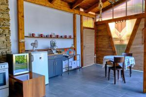 a kitchen with a table and a dining room at Villa Axa in Vrbov +24 photos