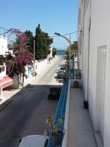a view of a street from a balcony of a building at Studio en rez-de-chaussée in Hammamet