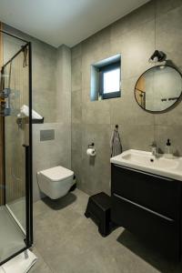 a bathroom with a sink toilet and a mirror at Nowa Osada in Łącko +126 photos