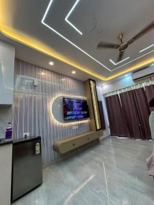a room with a flat screen tv on a wall at V studio in Ghaziabad