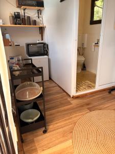 a bathroom with a toilet and a door to a room at Ecoclub in Varna City