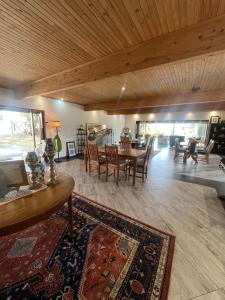 a living room with a table and chairs at FollyFoot Manor in Midrand