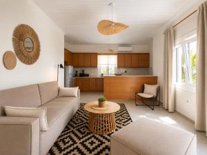 a living room with a couch and a table at THEONprivehouse in Koinyra