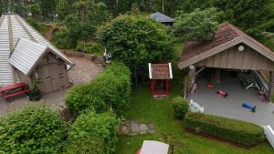 an aerial view of a miniature house with a yard at Vaicay Garden Resort in Arendal