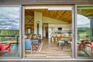 an open living room and kitchen with sliding glass doors at 128 Capitan Circle ("Basecamp") in Pagosa Springs