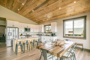 a kitchen with a wooden ceiling and a table and chairs at 128 Capitan Circle ("Basecamp") in Pagosa Springs