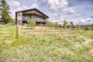 a wooden fence in front of a house at 128 Capitan Circle ("Basecamp") in Pagosa Springs