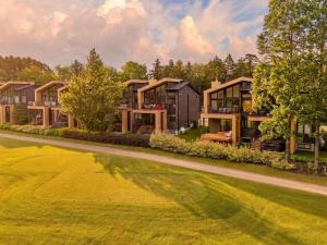 a row of houses on a golf course at Unit 178 - 4 bedrooms - Sleeps 8 in Beaupré