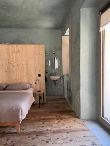 a bedroom with a bed and a sink in it at Casa Piumogna in Faido +44 photos