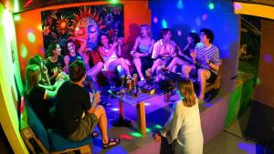 a group of people sitting in a room at Okan Rock Hostel Ella in Ella +186 photos