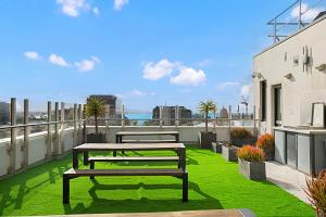 a balcony with a bench and green grass at Comfort Inn Geelong in Geelong