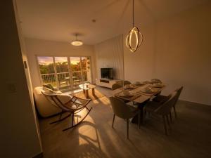 a living room with a dining room table and chairs at PH Palash Tower in Rousseau
