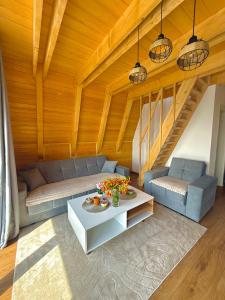 a living room with a couch and a table at Villa Kovacevic 2 in Bihać