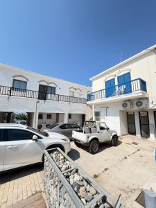 a white truck parked in front of a building at Harbour No4 in Polis Chrysochous