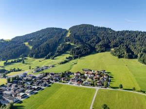 an aerial view of a village in the mountains at Hotel Ritterhof Ellmau in Ellmau