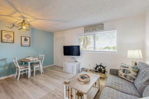 a living room with a couch and a table at MA221 The Tropical Cove 329 in Marathon +12 photos