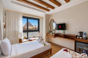 a hotel room with a view of the pyramids at PANORAMA view pyramids in Cairo