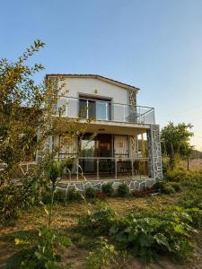 a house that is sitting in a field at Kindya Stone House in Kemikler