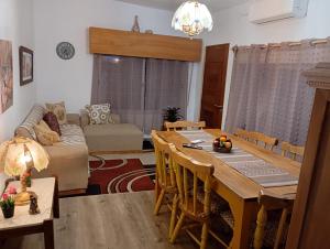 a living room with a table and a couch at Bed and Breakfast Omas Huisje in Ciudad de la Costa +34 photos