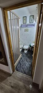 a bathroom with a toilet and a sink at Bed and Breakfast Omas Huisje in Ciudad de la Costa