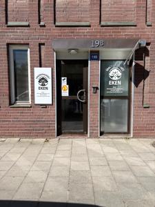 a store front with the doors open on a brick building at Vandrarhemmet Eken in Eksjö
