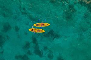 two yellow surfboards floating in the water at Hotel Isla Azul - Islas del Rosario in Isla Grande