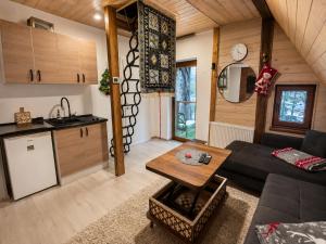 a living room with a couch and a table at KOTA - Prime Location in Jahorina